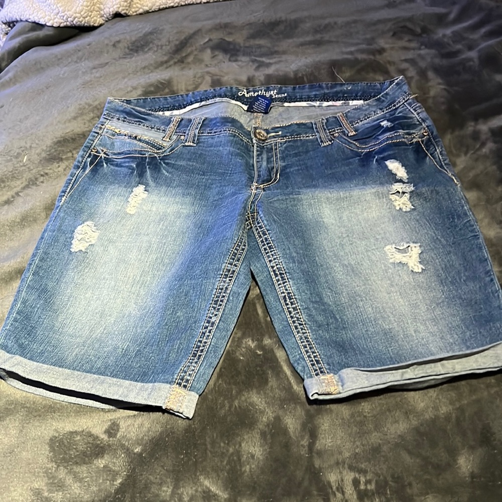 Distressed denim Bermuda shorts .